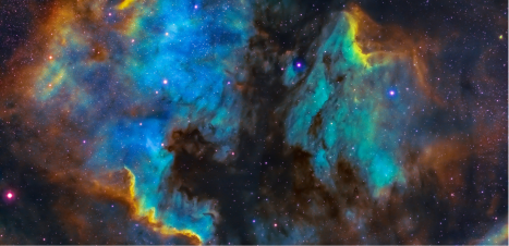 A vibrant celestial nebula with swirling hues of blue, gold, and purple, dotted with stars, showcasing the complexity of interstellar formations.